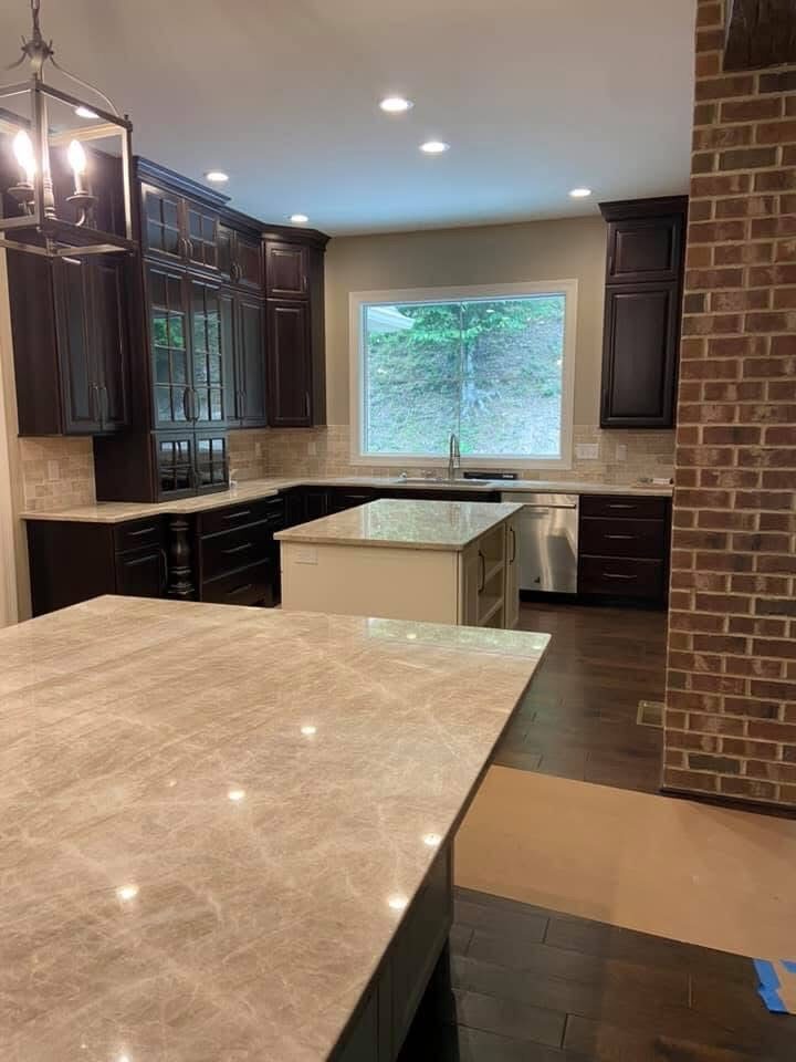 Kitchen with tile backsplash and island