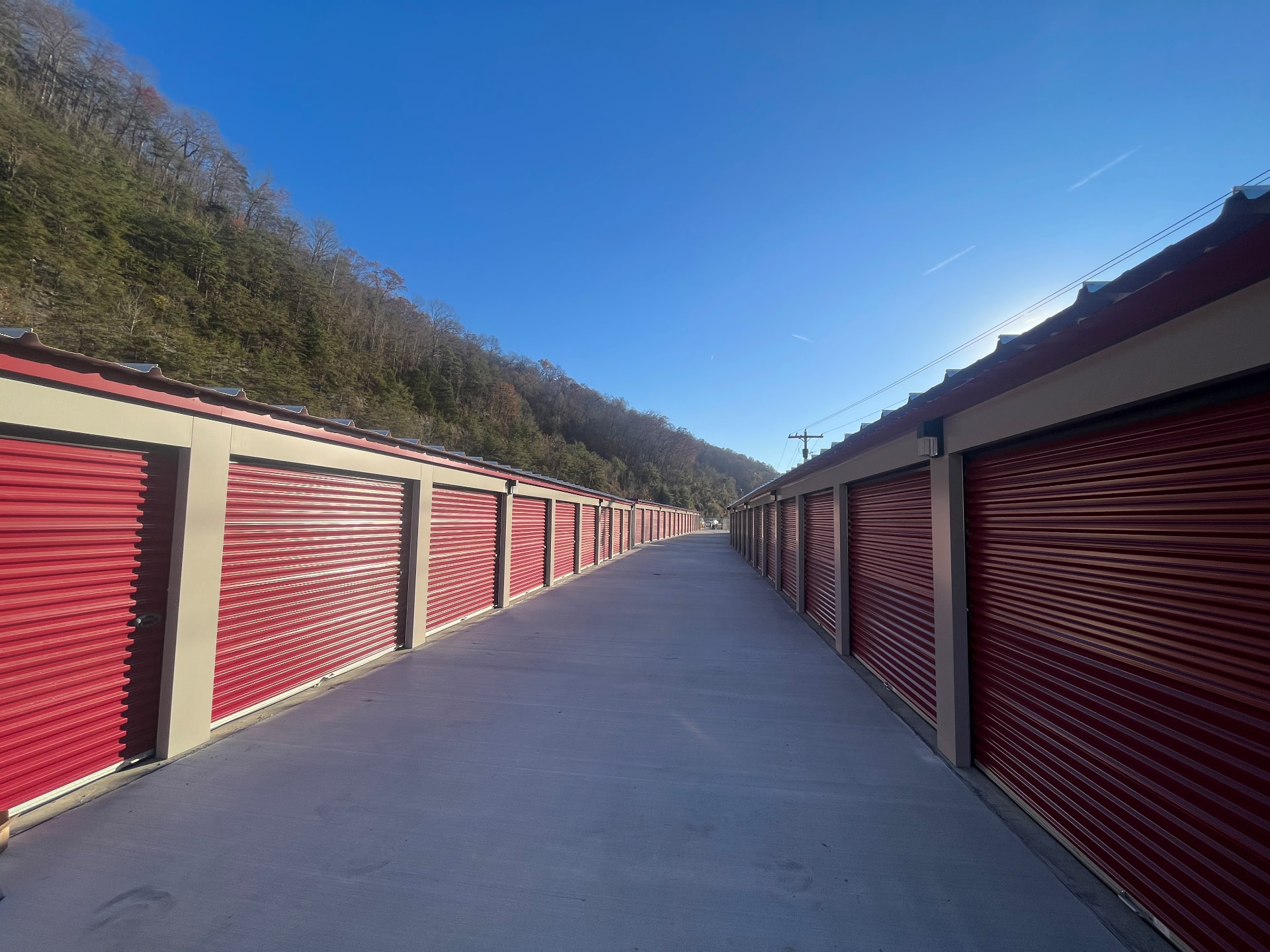 Rows of red drive-up storage units at Safe Haven Self Storage