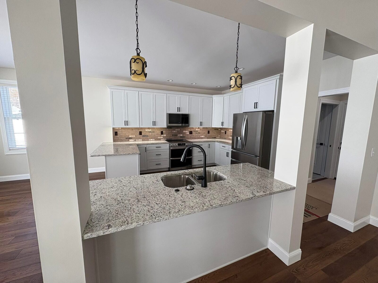 Open kitchen and dining area with granite counters