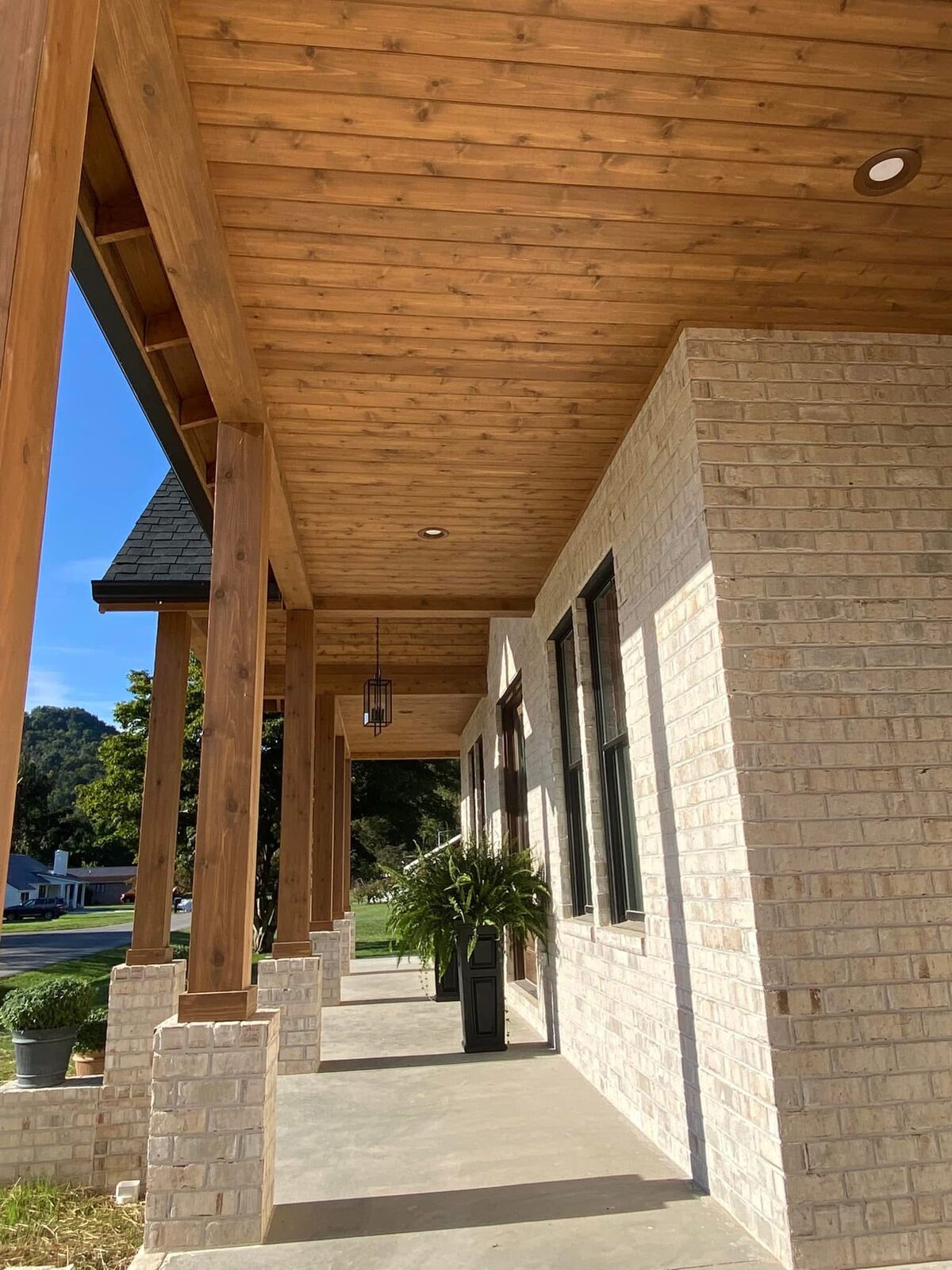 Wood-clad ceiling and beam detail in living space