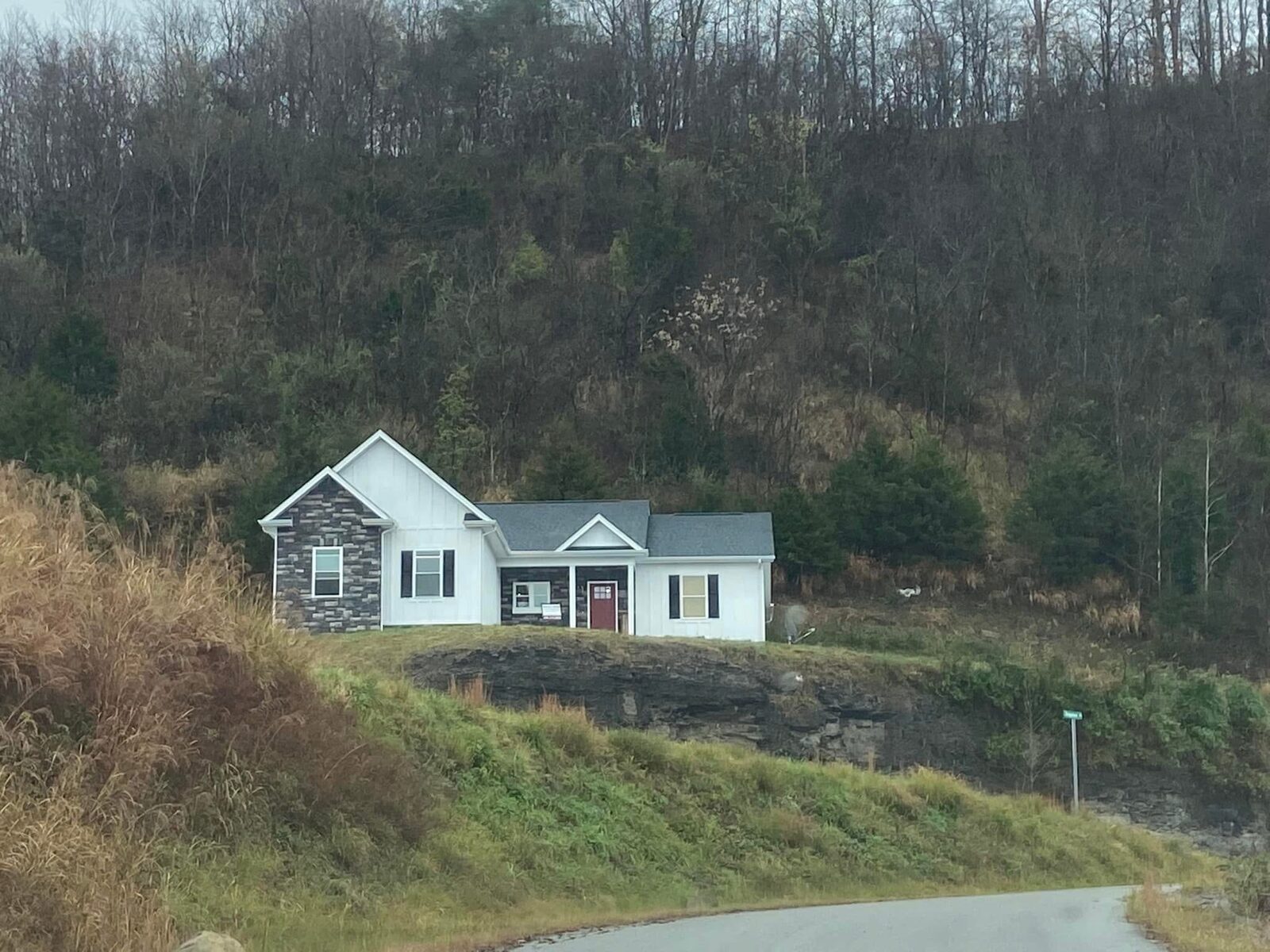 Completed single-story home in a mountain setting