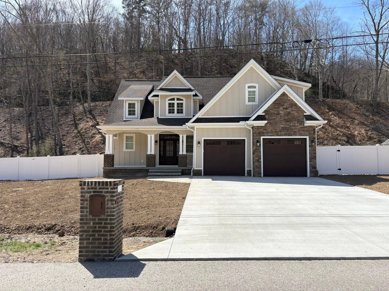 Custom home with three-car garage and concrete drive