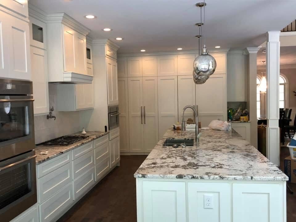 Kitchen with granite island and pendant lights